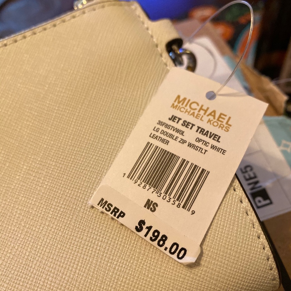 Michael Kor’s wristlet white leather